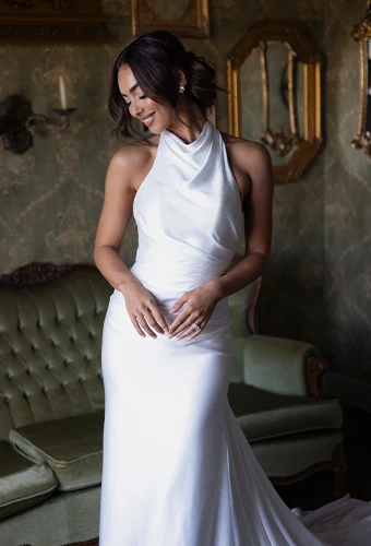 Bride wearing simple wedding gown with high neckline