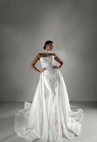 Bride wearing fit-and-flare wedding dress with detachable lace train, Martina Liana Luxe LE1415