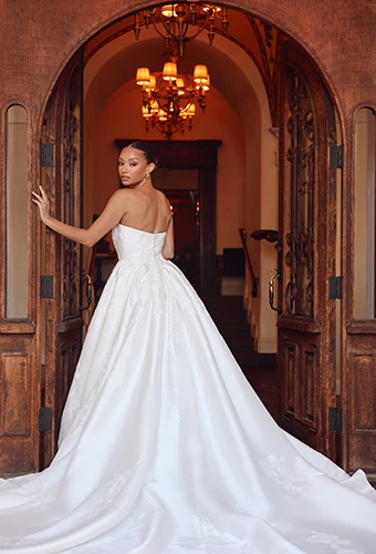 Bride wearing strapless Mikado ballgown with dramatic cathedral train, Essense of Australia d4265
