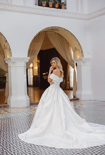 Bride wearing off-the-shoulder wedding gown with full royal train, Essense of Australia d4604