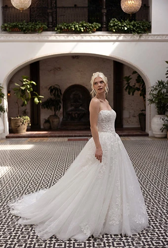 Bride wearing strapless ballgown with floral lace and sequin accents, Essense of Australia d4553