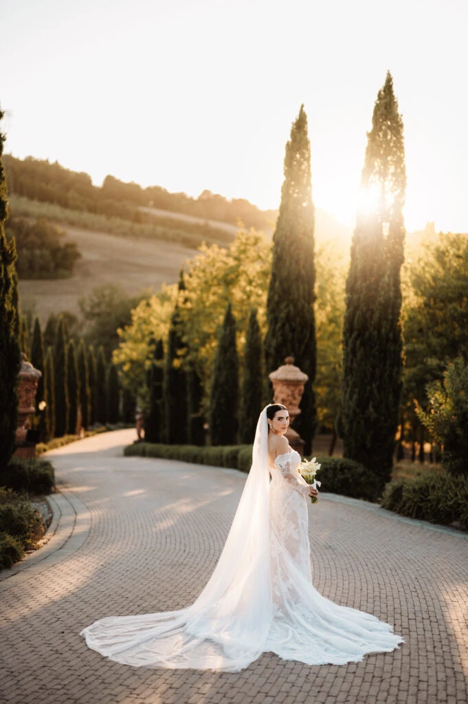 True bride Claudia posing in her wedding gown