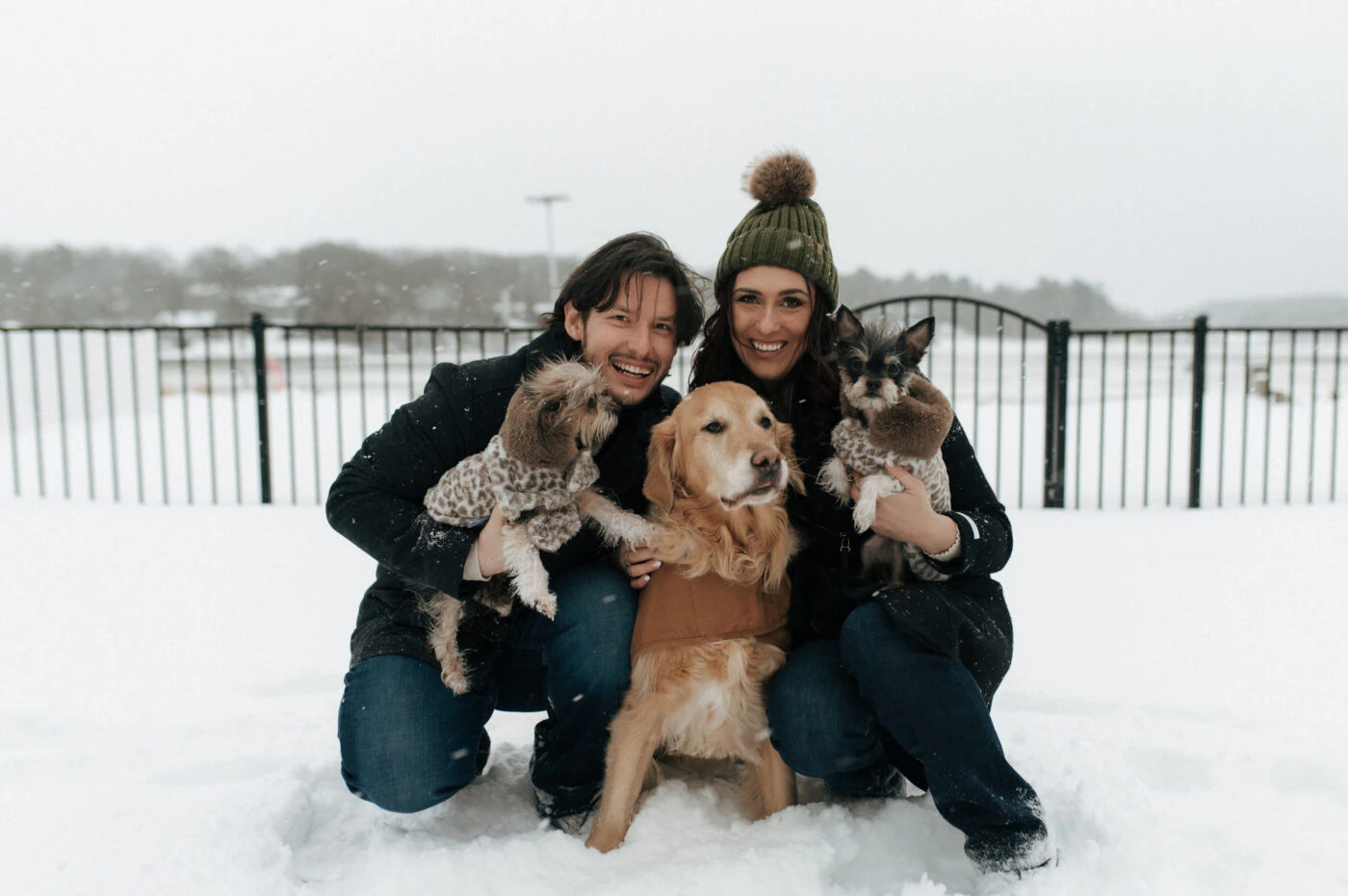 True bride Ashley posing with her husband and dogs