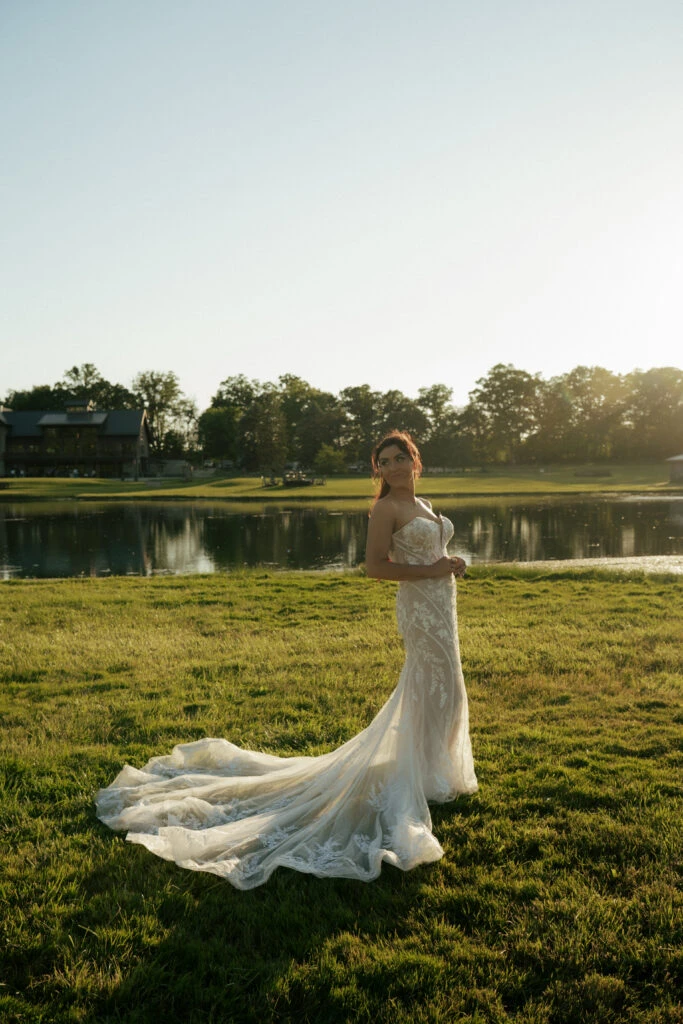 True bride Ashley posing in her wedding gown