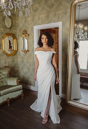 Bride wearing minimalist crepe wedding dress with sculpted ruching, Essense of Australia D4563