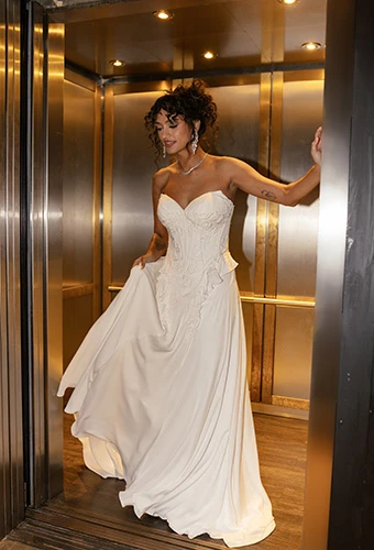 Bride wearing strapless crepe chiffon wedding dress with graphic lace, All Who Wander sedona