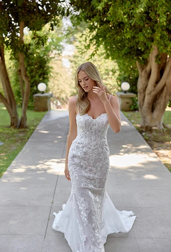 Bride wearing lace and tulle fit-and-flare wedding dress with floral embellishments, Essense of Australia D4344