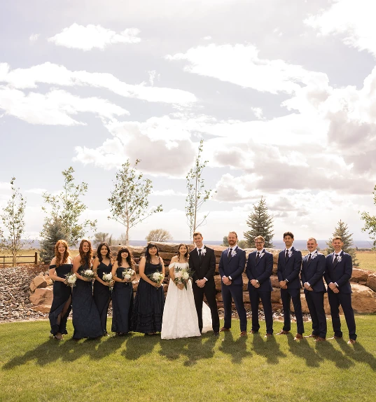 True bride Genesis posing with her bridal party