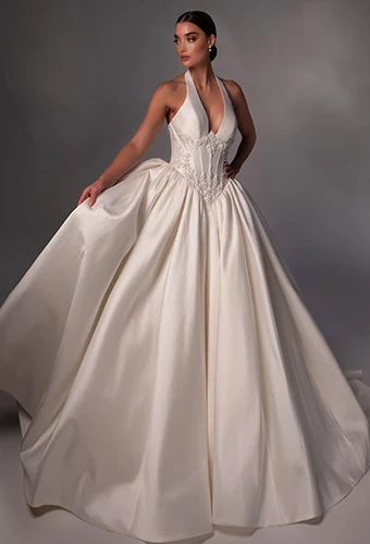 Bride wearing halter top ballgown wedding dress with plunging neckline