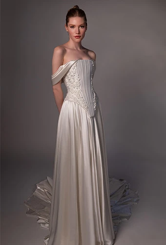 Bride wearing faux two piece wedding gown with off the shoulder straps