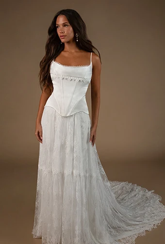 Bride wearing faux two piece wedding gown with lace skirt and spaghetti straps