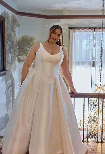 Plus-size bride wearing Mikado ballgown with basque waist and pleated skirt, Essense of Australia D4451+