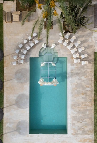 Outdoor wedding venue with pool and ceremony altar