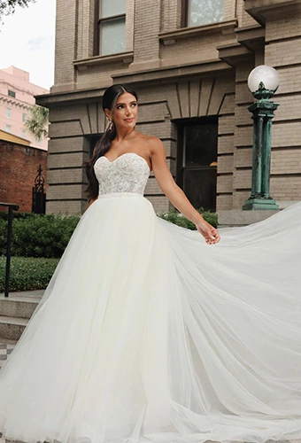 Bride wearing strapless wedding dress with detachable tulle overskirt, Essense of Australia D4133
