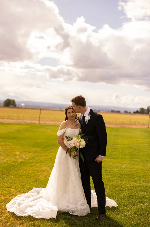 True bride Genesis posing with her husband