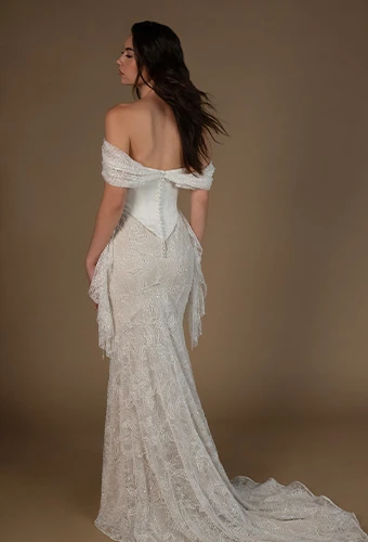 Bride wearing a column wedding gown with lace and pearl detailing