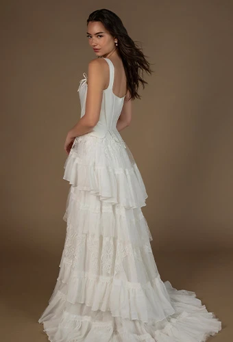 Bride wearing lace wedding gown with straps